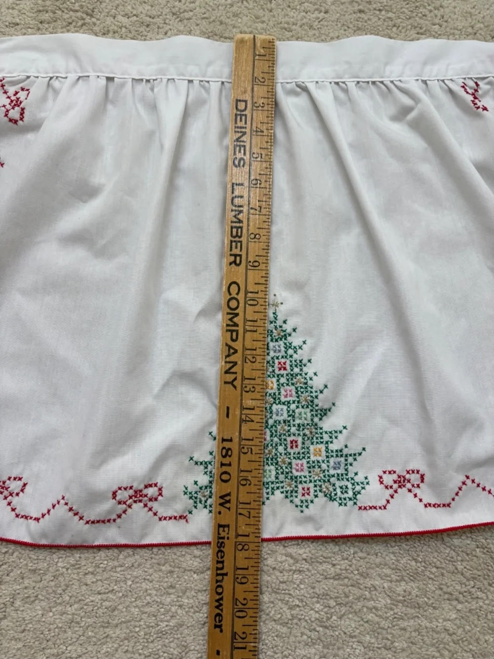 Vintage white half apron featuring hand-stitched cross-stitch Christmas trees